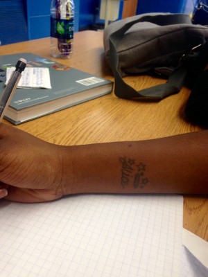 Tyneisha Lester's '16 tattoo of her grandmother's name, Alice on her wrist.