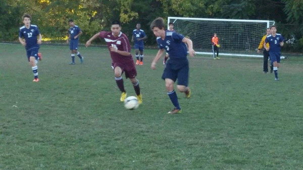 Boys Soccer defends a play from the opposing team 