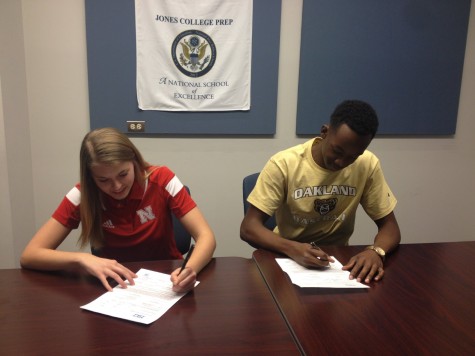Julie Lohman 15 and Jordan Jackson 15 signing the official papers to become Division I NCAA Athletes
