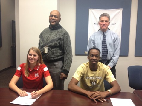 Jordan Jackson '15 and Julie Lohman '15 with their high school coaches, Frank Menzies and Dave Rosene