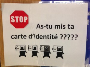 Outside a French classroom a sign reads, Where is your ID card?