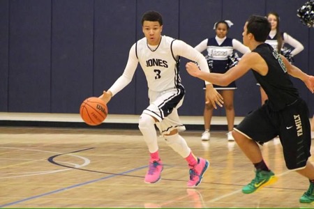 Bryson Phillips 17 playing in a varsity basketball game