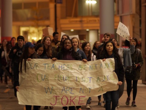 Students march outside after being locked out of the Thompson Center by police. 