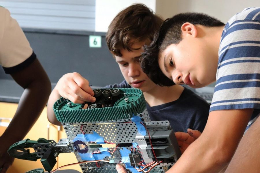 Sean Herbst ‘20 (left) and Cesar Rodriguez ‘19 (right) work with their prototype.