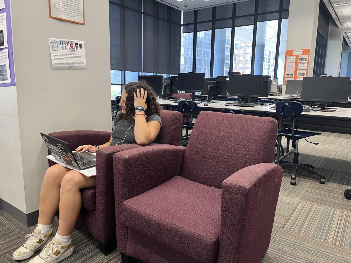 Martin working on her AP Research project in the Jones Library.