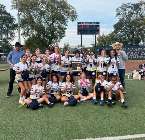 Jones Girls Flag Football Varsity team post-win. Photo credit to Anthie Katris.
