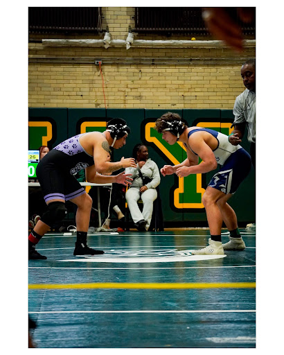 Jones wrestler Micah Ruiz ‘27 squares up in a meet.
