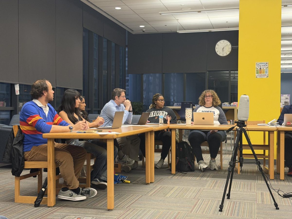 Principal Kerry Dolan talks to LSC representatives about the Homecoming contract at Soldier Field. A special LSC meeting was held on Sept. 30 to approve the contract.