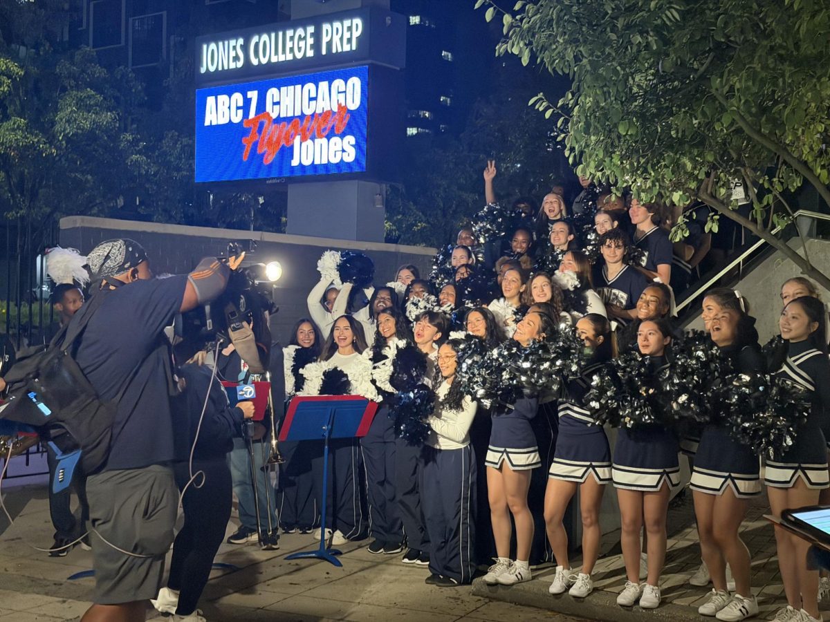 Students gather by the courtyard stairs to cheer in front of the ABC 7 Chicago cameras while the school band plays in the background. Students and staff gathered early in the morning to showcase Jones in ABC 7 Chicago’s Friday Flyover segment.